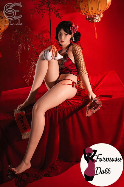 Side profile of Lumi.B silicone sex dolll with red satin outfit and floral headpiece against a red background, featuring 'Formosa Doll' branding.