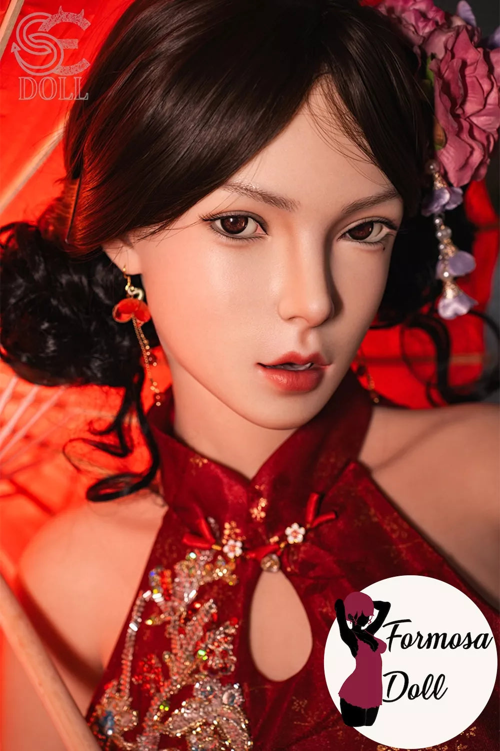 Close-up of Lumi.B silicone sex doll face with natural facial sculpt wearing a red outfit with floral decorations, featuring the Formosa Doll logo.